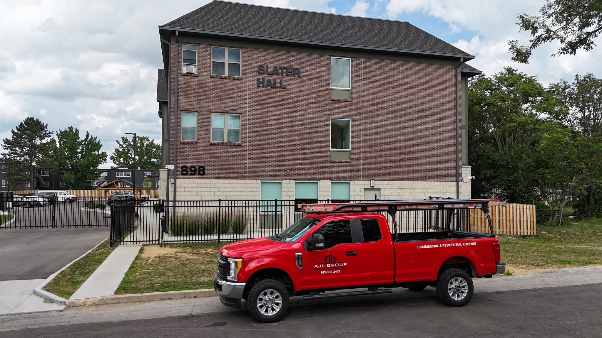 AJL Group truck at a multi-family commercial project